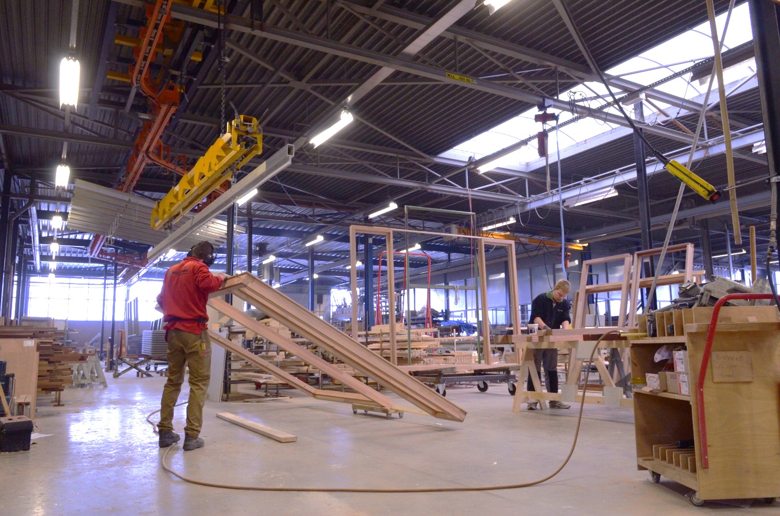 Dutch Joinery Alliance stand and visitors at the woodworking exhibition
